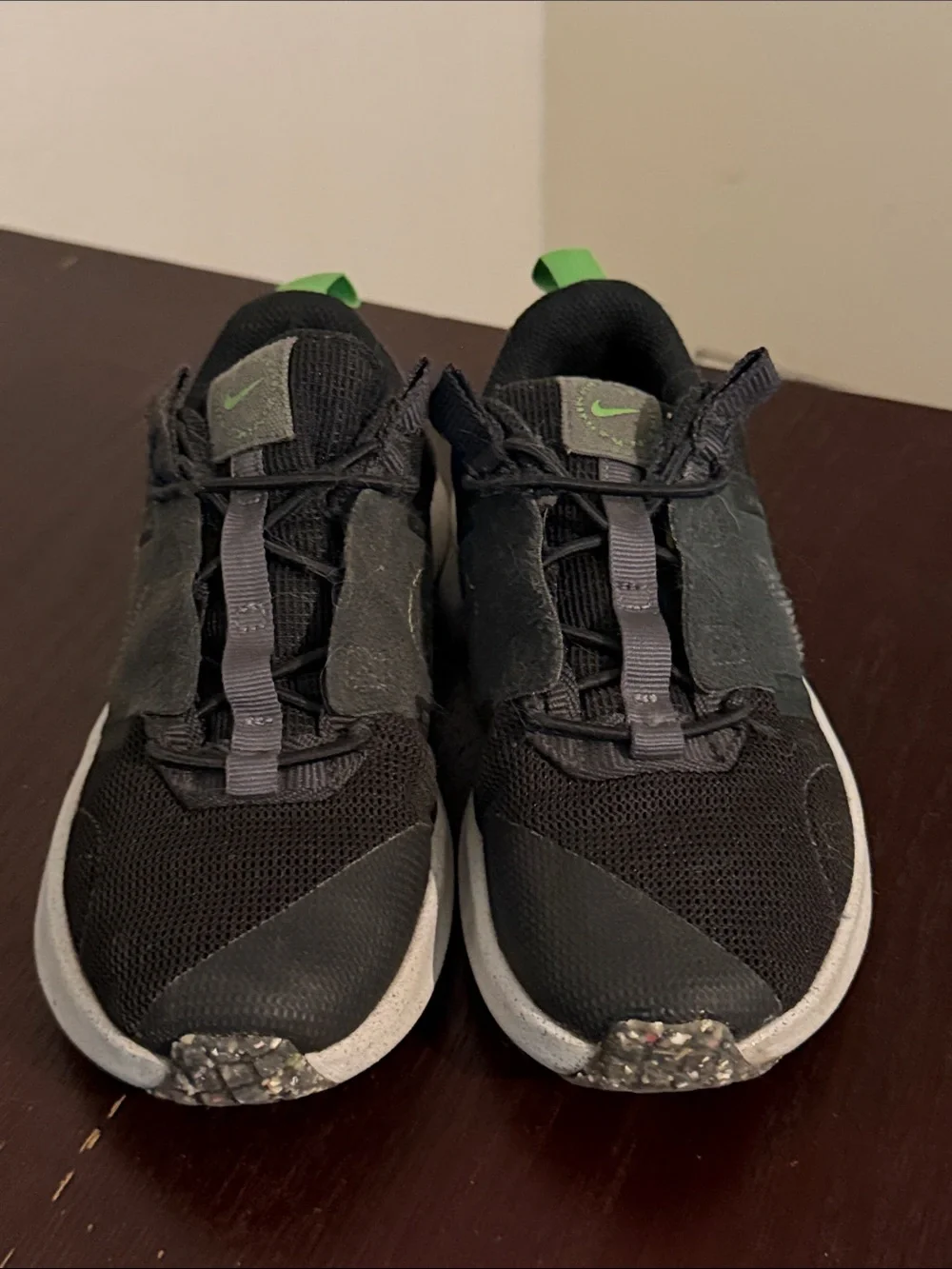 Nike Black Sneakers with Green Accents for Kids